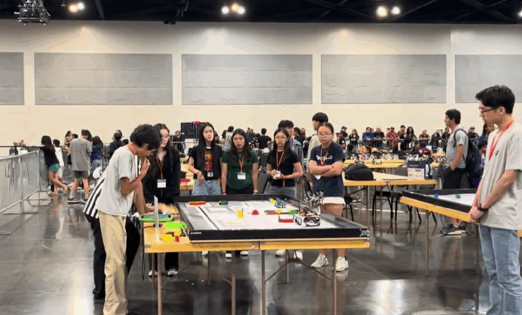 A group of students competing in a robotics tournament.
